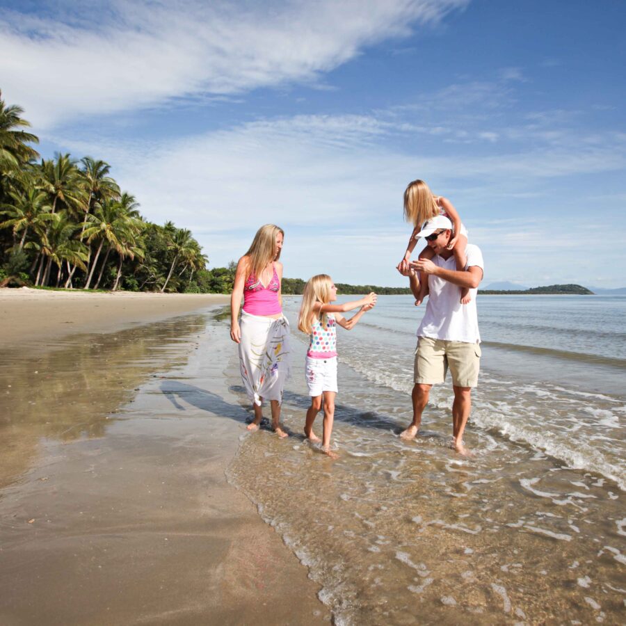 Family Walking on Four Mile Beach in Port Douglas